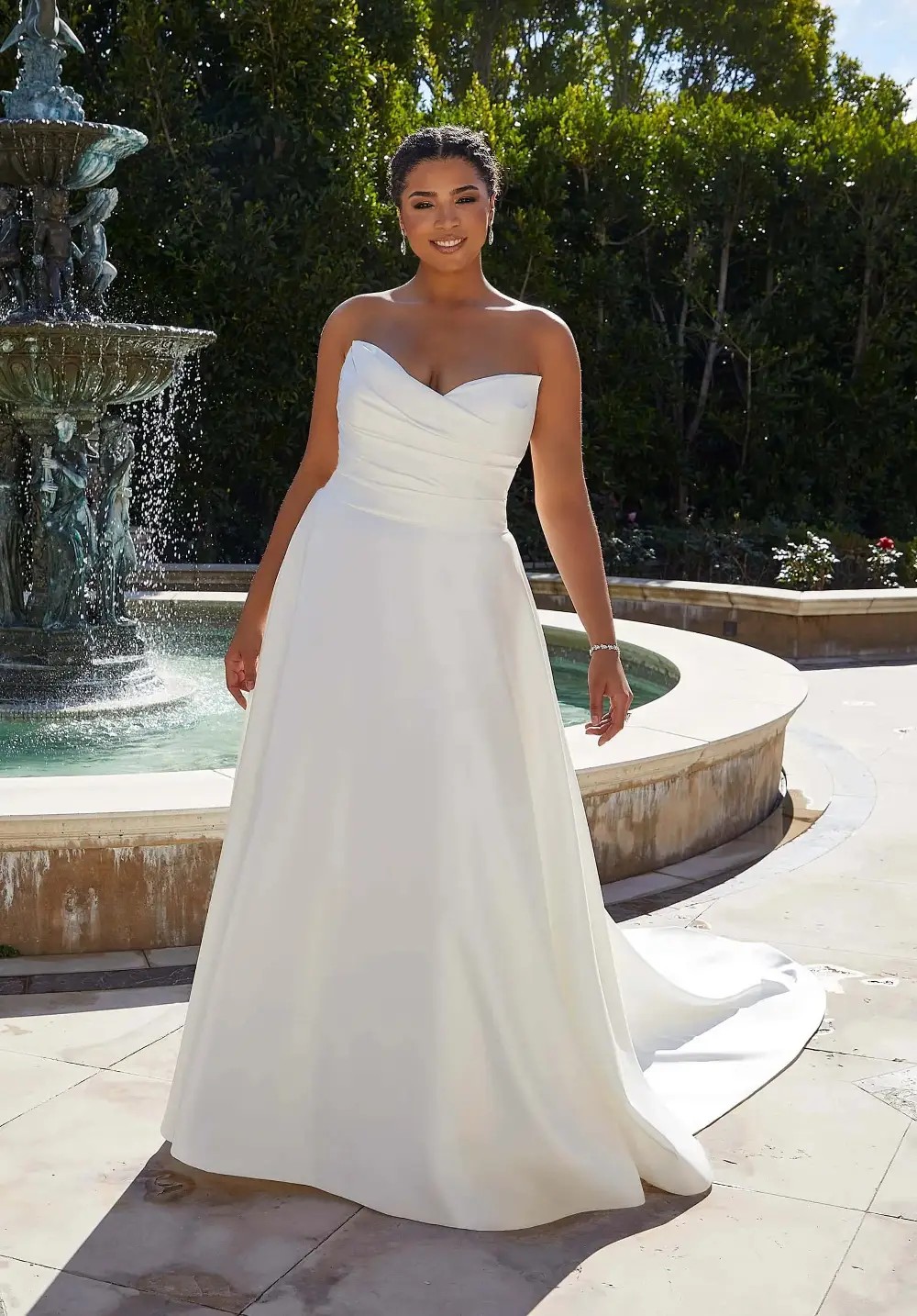 Model wearing a Plus Size gown